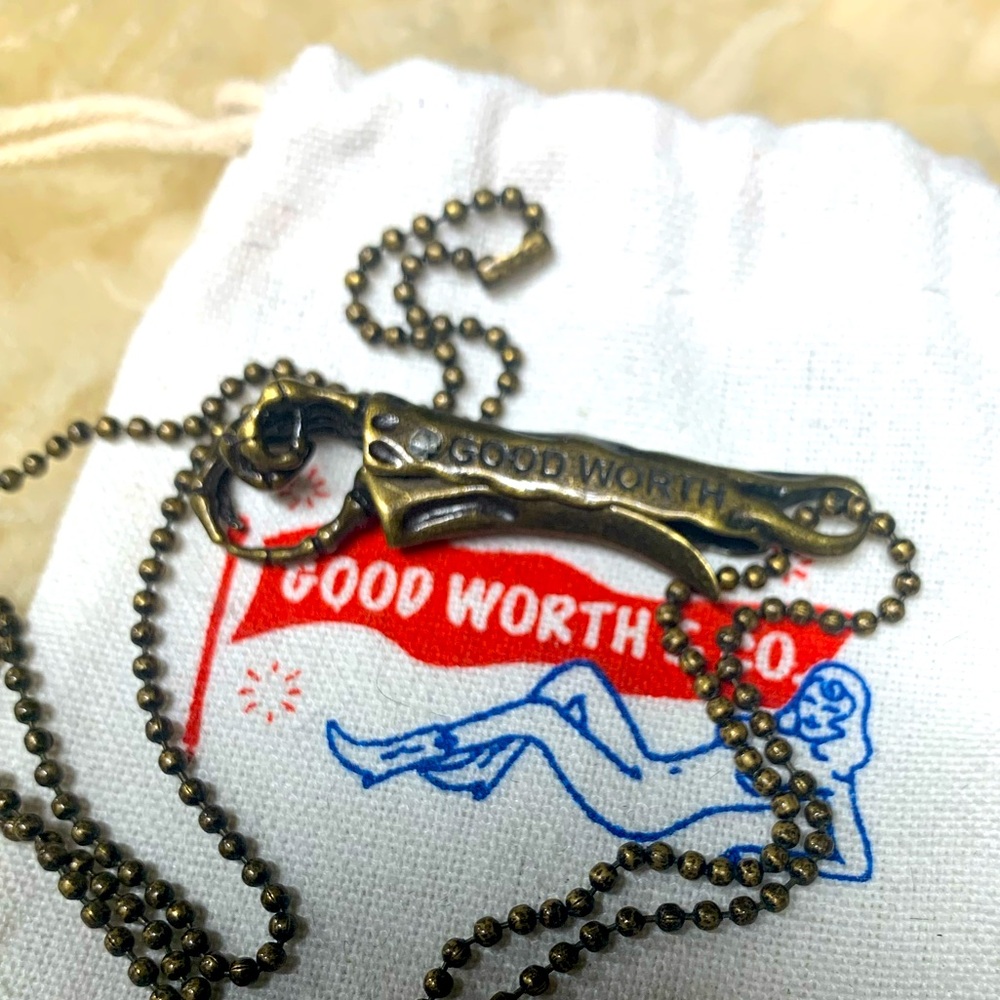 Good Worth & Co. Antique brass skeleton clip necklace.